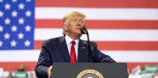 Trump Pushes Stricter Election Rules Donald Trump speaks at a podium with a U.S. flag backdrop; Teddy Williams and Caraun Reid not visible