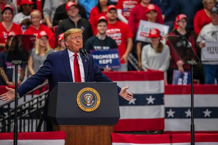 shutterstock_1789781168 Donald Trump speaks at a rally; Teddy Williams and Bear Pascoe are in the crowd
