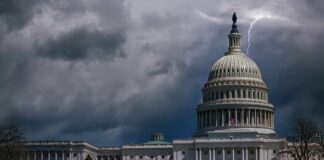 United States Capitol building under stormy skies with lightning