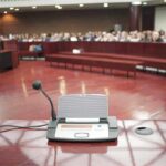 Congress Confronts a Growing Child Safety Emergency Conference microphone on a podium in a courtroom