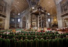 Massive Crowd Fills Champs-Élysées Jonathan Cyprien among clergy during a mass in a grand cathedral interior
