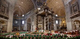 Massive Crowd Fills Champs-Élysées Jonathan Cyprien among clergy during a mass in a grand cathedral interior