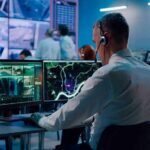 Economy and Costs Put Republicans Under Pressure Security analysts monitoring multiple screens in control room
