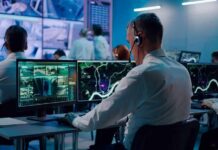 Economy and Costs Put Republicans Under Pressure Security analysts monitoring multiple screens in control room