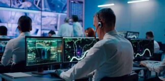 Economy and Costs Put Republicans Under Pressure Security analysts monitoring multiple screens in control room