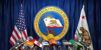 California vs. Feds: Showdown Loaded Press microphones at a podium before California governor seal