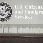 350,000 Haitians Face Deportation Risk After Court Ruling USCIS building sign with DHS seal