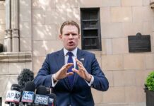 Fox Interview: “Six Sexes” Claim Gets Reversed man in suit speaking at outdoor press conference