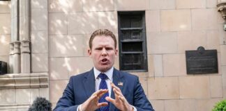 Fox Interview: “Six Sexes” Claim Gets Reversed man in suit speaking at outdoor press conference