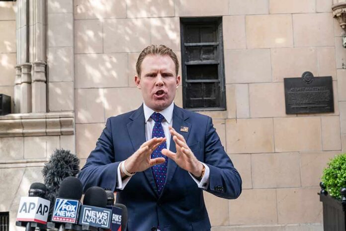 man in suit speaking at outdoor press conference