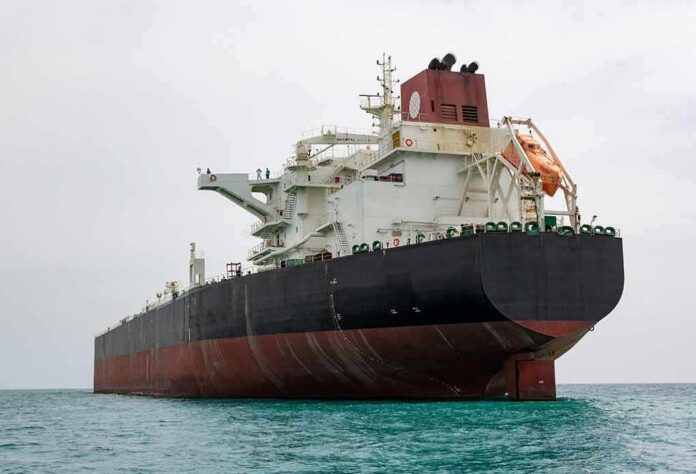 shutterstock_1985991914-1 Large oil tanker anchored in calm sea