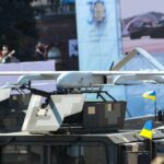 Drone Strikes War Escalation After Retaliation Military drone mounted on armored vehicle
