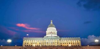 Utah State Capitol building at dusk with illuminated dome