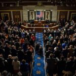 Trump’s Former Lawyer Is Now Attorney General Legislative chamber audience stands and applauds