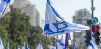 Gaza Relocation Plan Puts Mass Transfer Back in Focus Israeli flags waved at a street demonstration