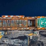 European Ship Seizures Draw Threat Cargo ship docked at port seen from above