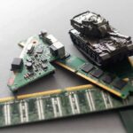 Toy tank on computer memory sticks and circuit boards