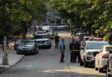 Suspected Body Parts Weren’t Human Police officers secure a residential street with patrol cars and yellow tape
