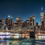 A Fire Broke Out as 60,000 Fireworks Lit Up New York New York City skyline at night with Brooklyn Bridge