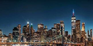 New York City skyline at night with Brooklyn Bridge