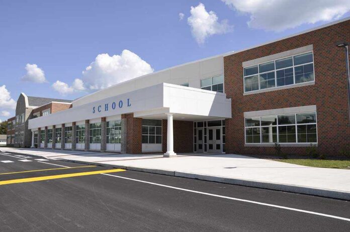 Exterior,Of,A,Modern,School,Building,Entrance Modern school building with large windows and a clear sky