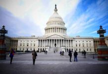 United States Capitol building with visitors on the plaza