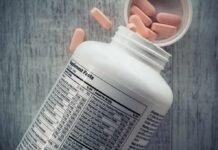 Tomato Paste May Boost Brain Performance Vitamin supplement bottle with pink tablets and nutrition label