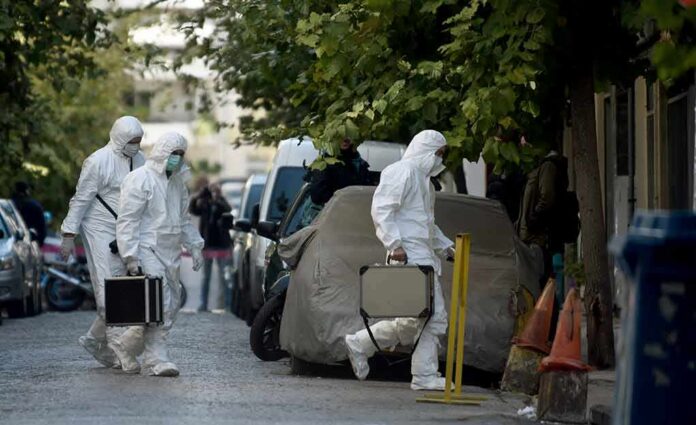 shutterstock_779710051 forensic investigators in white protective suits walking on a city street