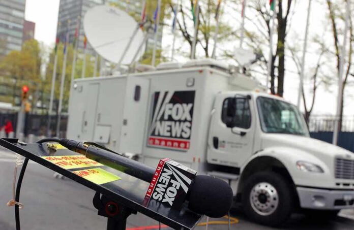 shutterstock_791691394 Fox News microphone and satellite truck on city street