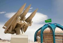 Saudi Airports Hit as Houthi Attacks Escalate missile launcher beside domed building with green flag