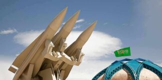 Saudi Airports Hit as Houthi Attacks Escalate missile launcher beside domed building with green flag