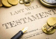 Last will and testament document with fountain pen, coins, key, and pocket watch