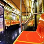 Bronx Subway Attack Sparks Safety Fears Empty subway car with orange seats and open doors
