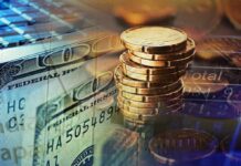 Stack of coins with US dollar bills and financial data overlay