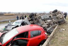 Multi-Truck Wreck Ends Veteran’s Return Overturned truck and damaged cars after highway crash