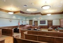 Judge in Maduro Case Dies at 92 Empty courtroom with wooden benches and judge's bench