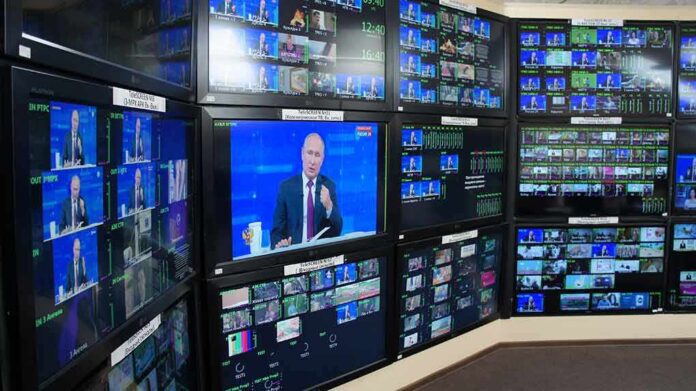 Vladimir Putin on multiple control room monitors