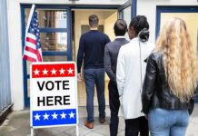 Socialism Debate Shapes Midterm Campaigns Voters standing in line at a polling place entrance