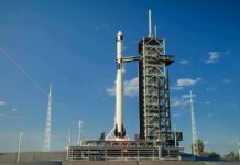 Japan Launches Mars Moon Sample Mission Rocket on launch pad under clear blue sky