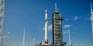 Rocket on launch pad under clear blue sky