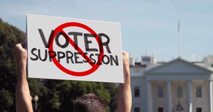 Protester holding a sign in front of a government building