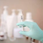No Wires, No Battery: A New Approach to Nerve Stimulation Gloved hand holding a syringe