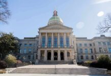 State capitol building with gold dome and columns