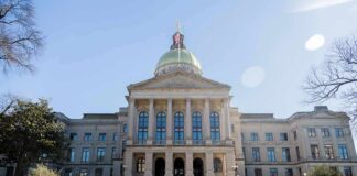 State capitol building with gold dome and columns