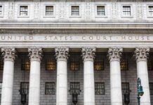Judge Strikes Down Federal Noncitizen Voting Law United States courthouse facade with Corinthian columns