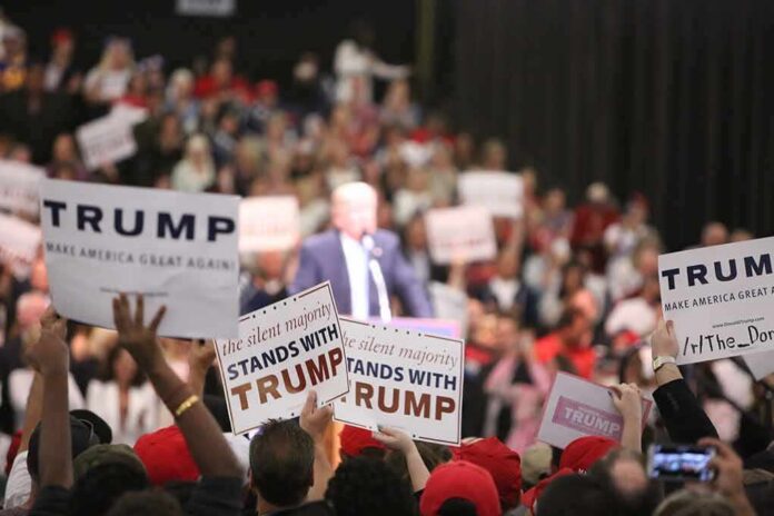 shutterstock_427399234 supporters hold signs at a political rally