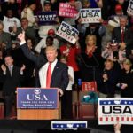 Ohio Brawl: Trump Rally Turns Violent Donald Trump addresses a rally crowd at a podium, raising his fist