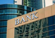 Brink’s Blunder: $128K Found on ATM Returned to Bank bank building exterior with glass and signage