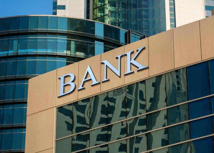 bank building exterior with glass and signage