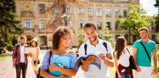 Columbus Day vs. Indigenous Peoples’ Day College students walking on campus with books and backpacks